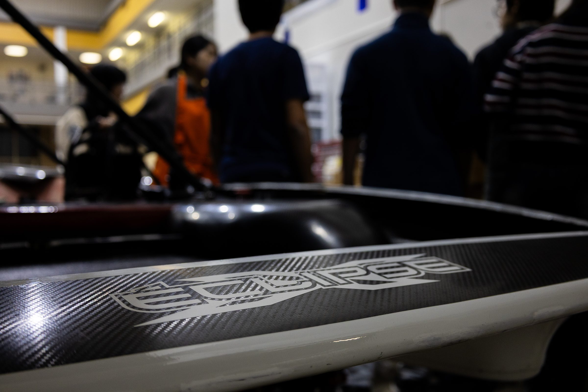 Close-up of the carbon-fiber body panel with the Carrera decal